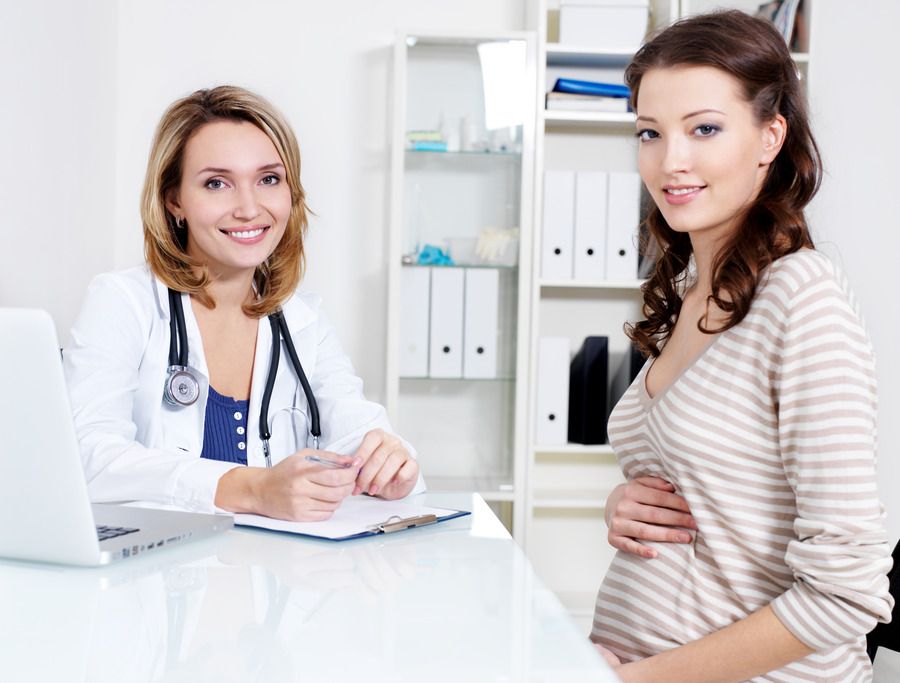 happy-beautiful-young-pregnant-woman-smiling-doctor-hospital (1).jpg